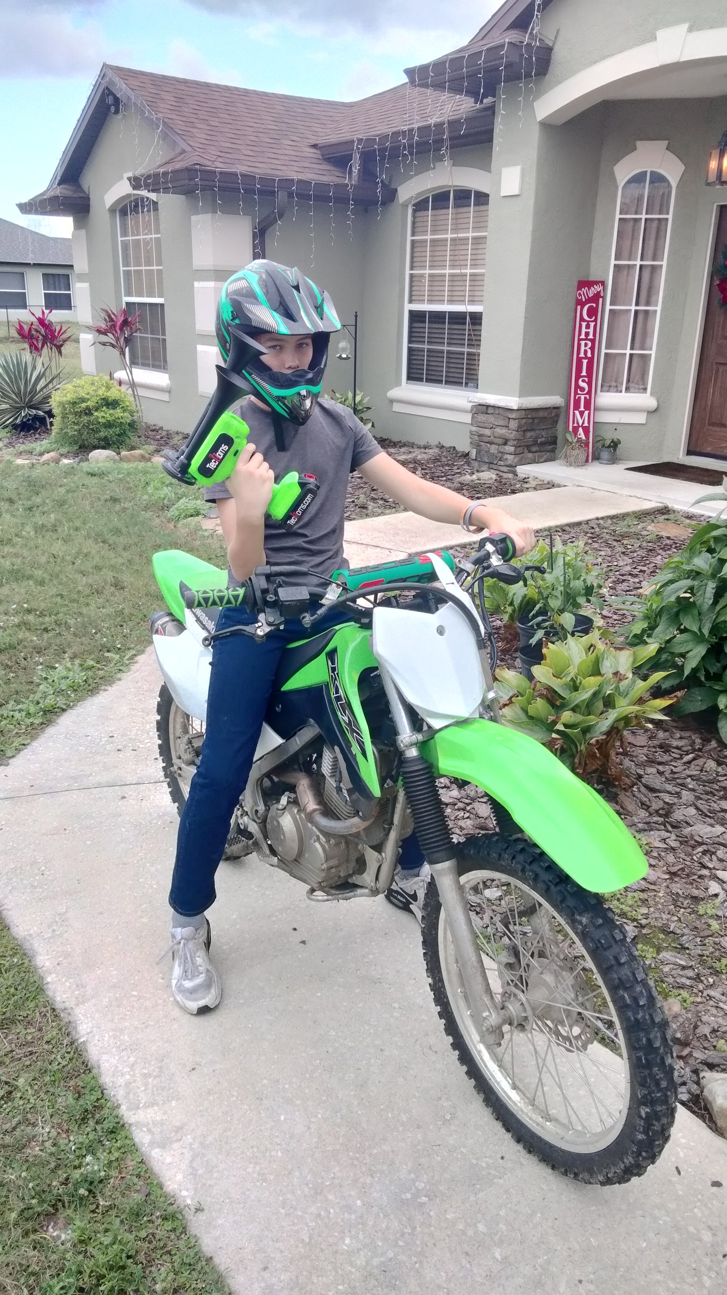 TecHorns Green 2-Horn – single color handheld train horn with 20V lithium battery, shown with boy sitting on dirt bike