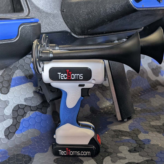 TecHorns White, Blue, and Black 2-Horn – triple color handheld train horn, 130 dB with 20 V lithium battery, photographed on blue camo golf cart flooring